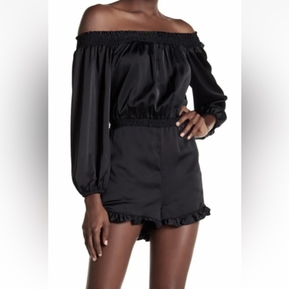 NWT Bebe Black Satin Sheen Ruffle Trim Off the Shoulder Long Sleeve Romper LL17